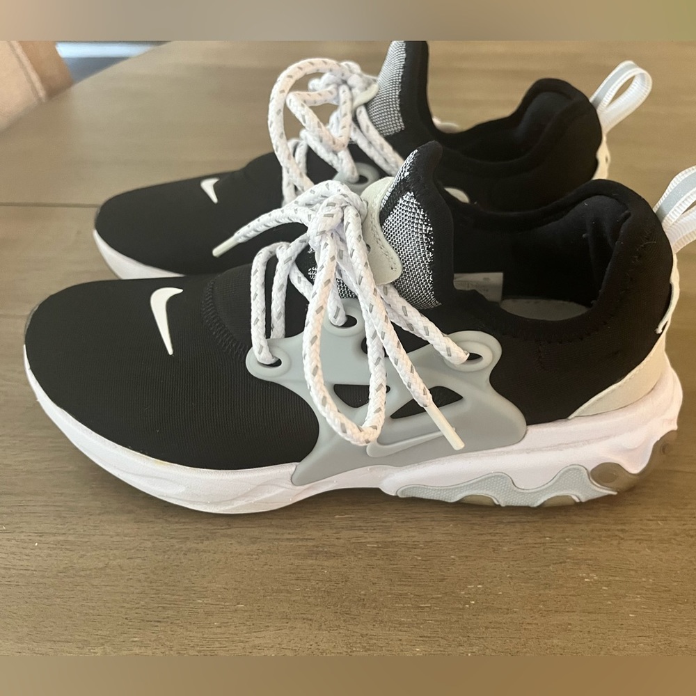 Nike Womens running shoe.  Black, Baby Blue and White.  Size 6.5.